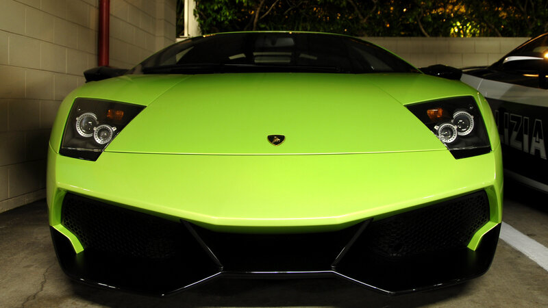 green lamborghini in parking garage