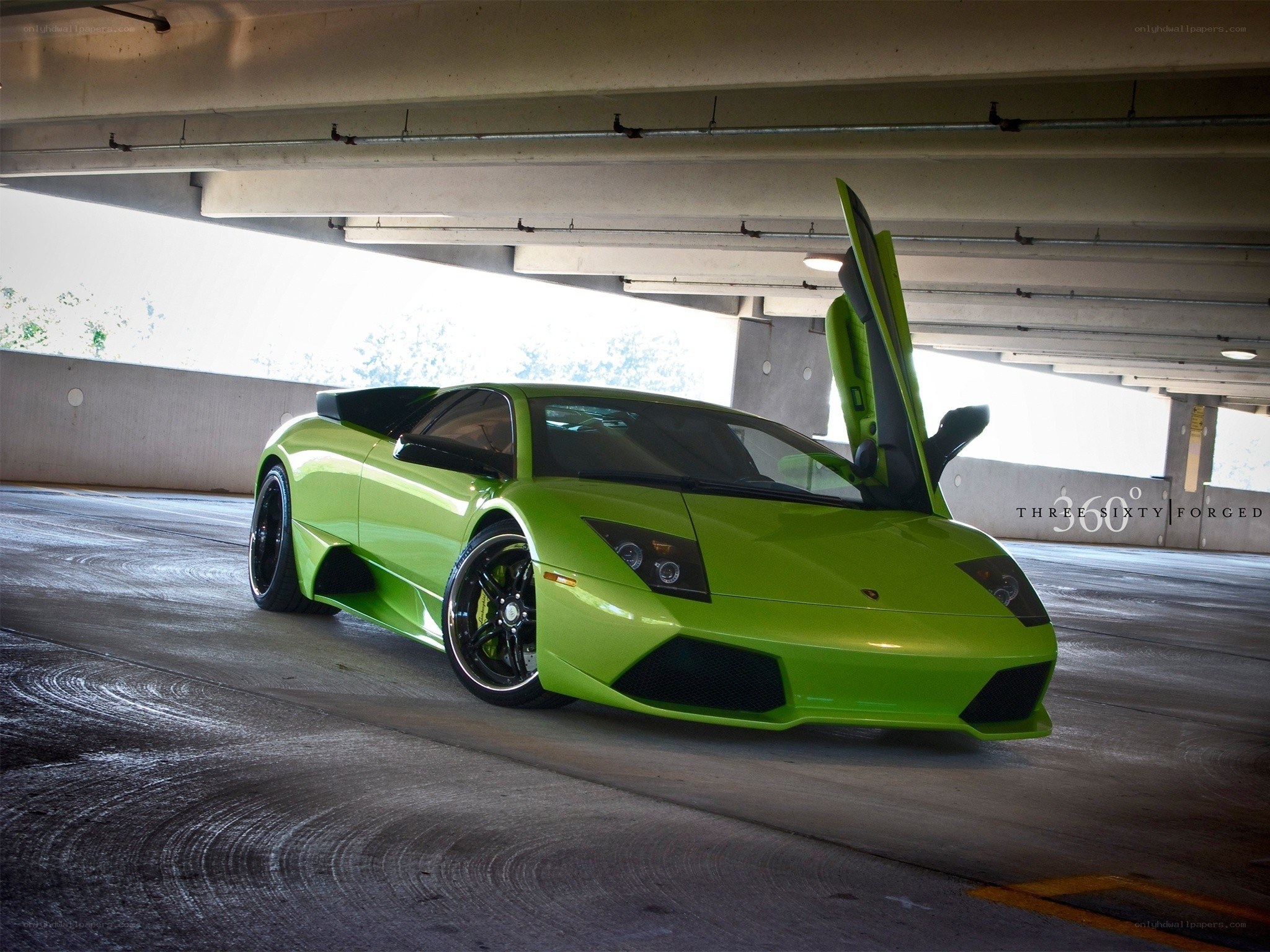 Green Lamborghini in parking garage