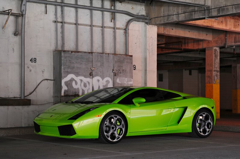Green Lamborghini in parking garage