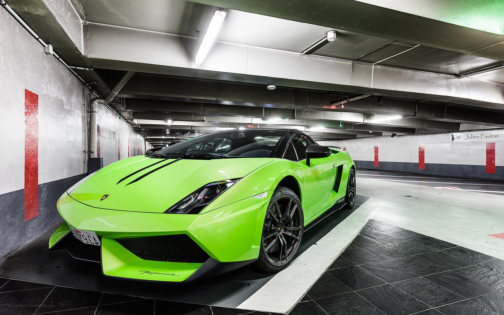 Green Lamborghini in parking garage