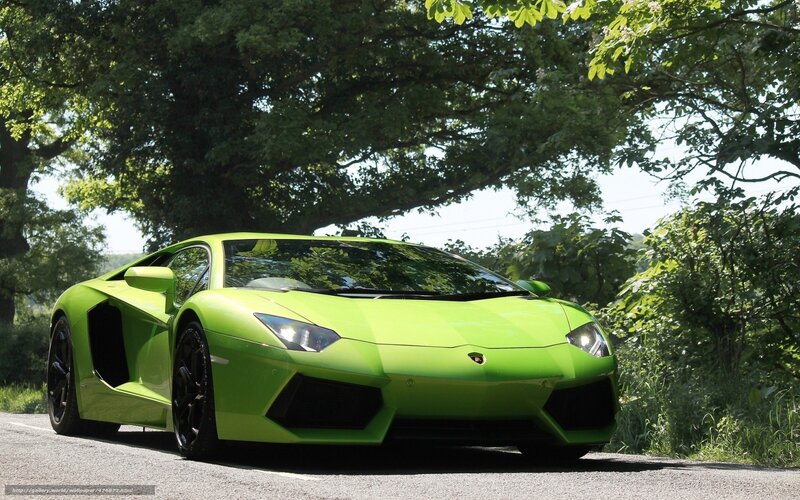 Green Lamborghini on a country road