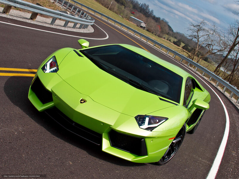 Green Lamborghini on a winding road