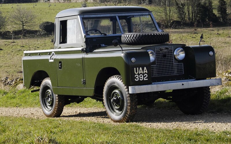 Green Land Rover pickup truck