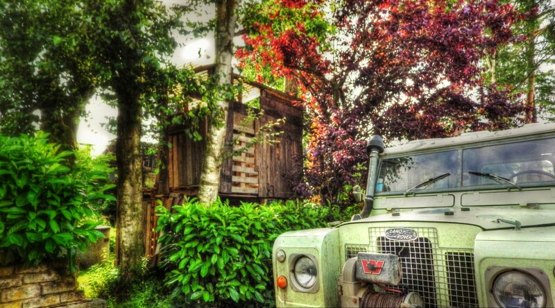 Green Land Rover Vehicle — Natural