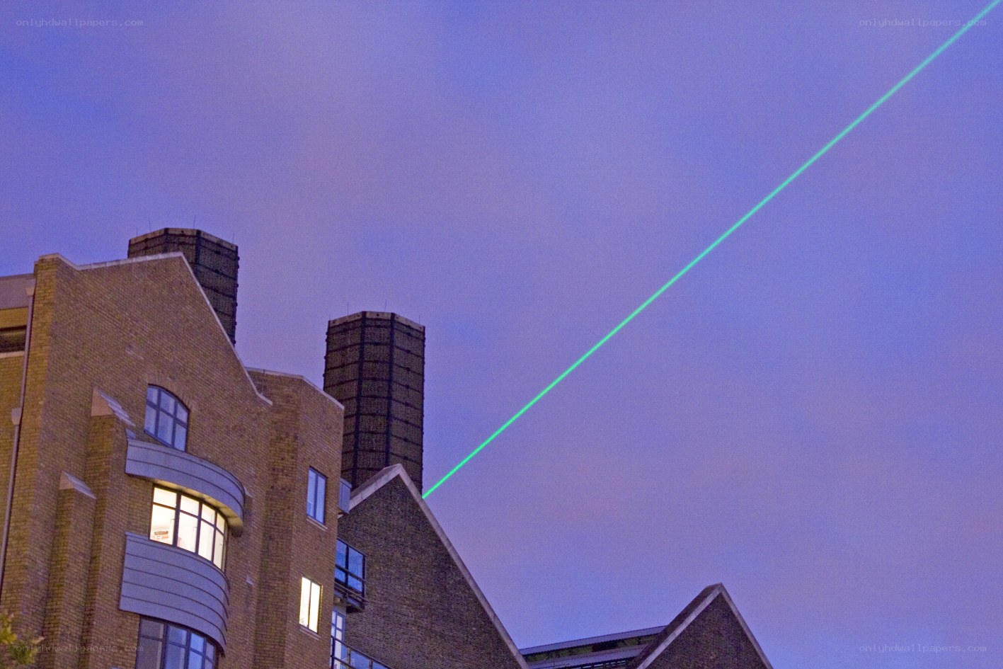 Green laser beam in the sky