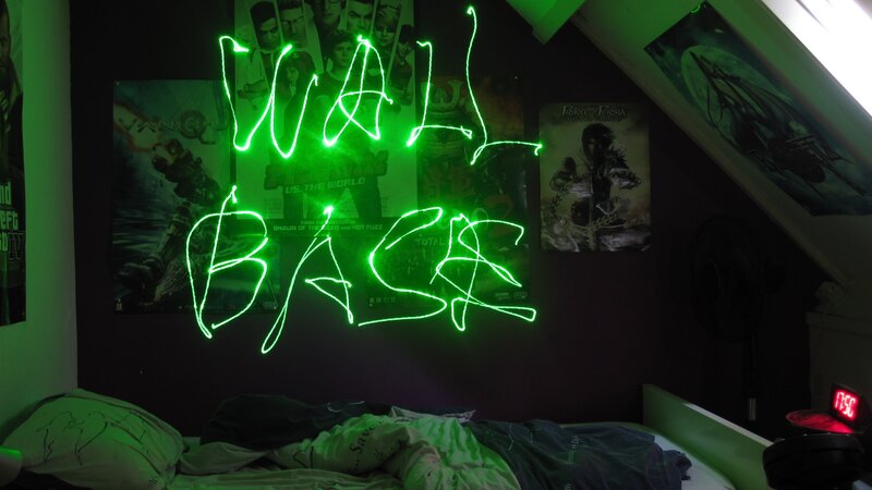 green laser graffiti in bedroom