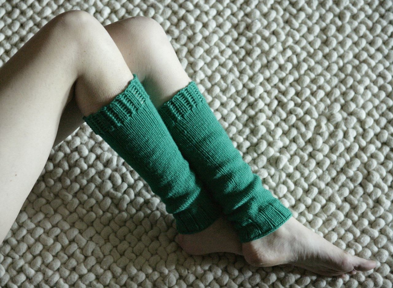green leg warmers on carpet