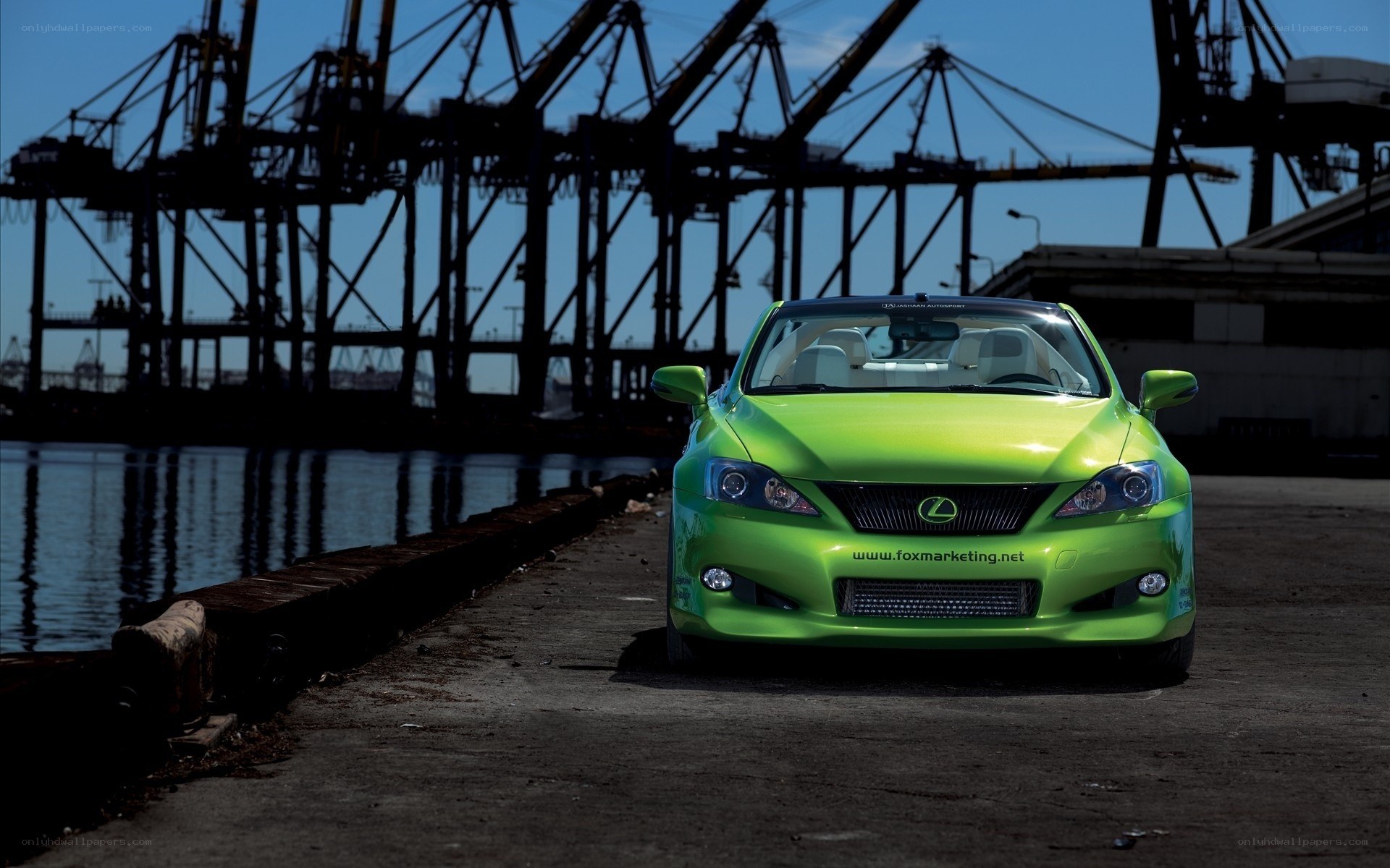 Green Lexus at a port