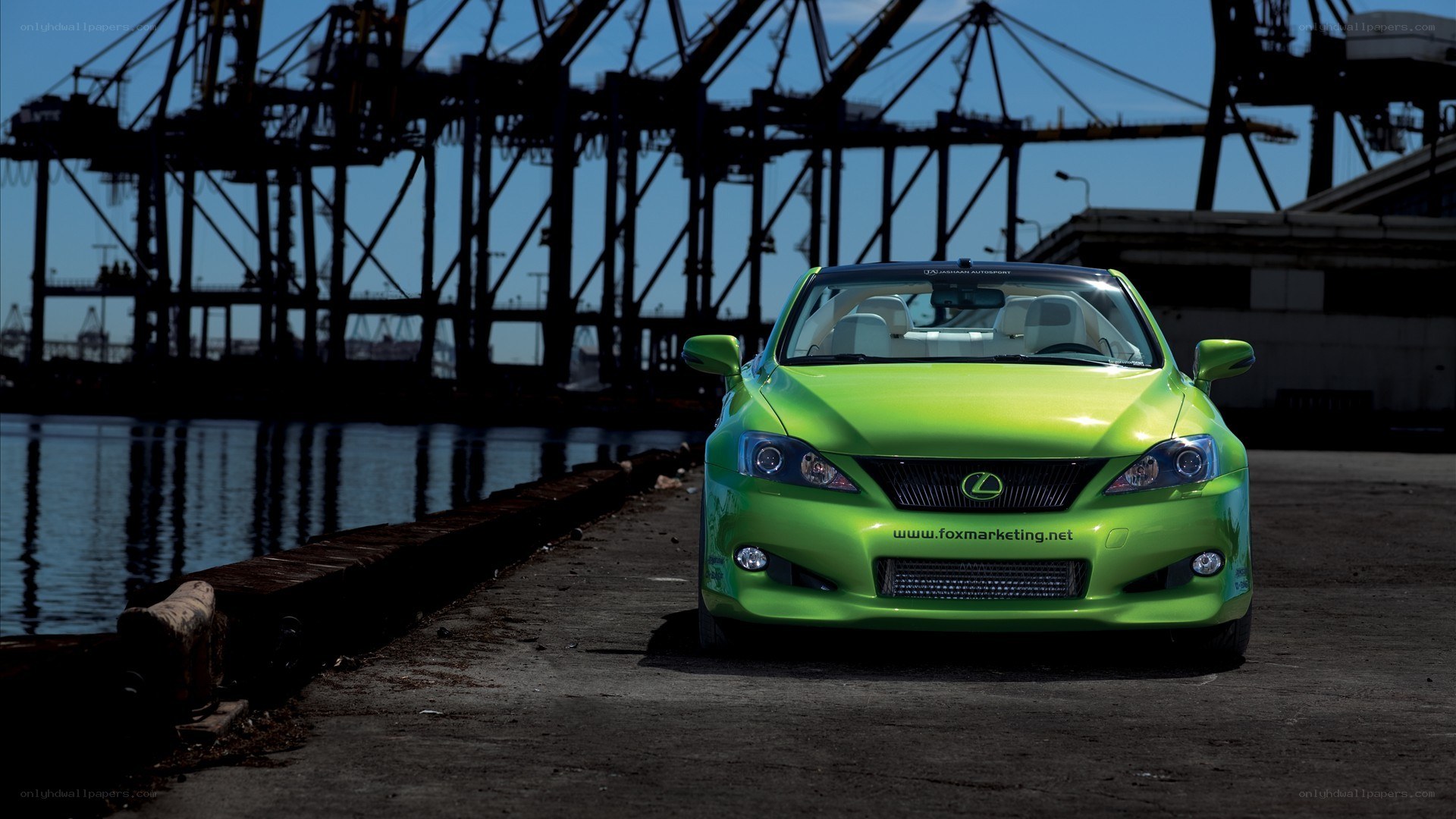 Green Lexus at a port