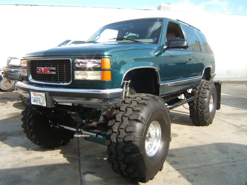 Green Lifted GMC SUV