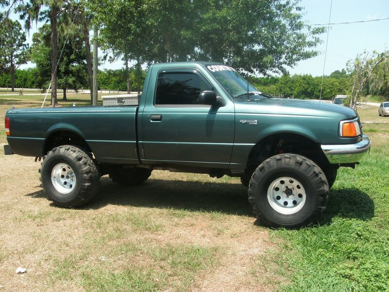 Green Lifted Pickup Truck — Outdoor, Afternoon
