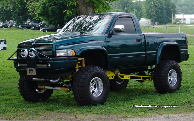 green lifted pickup truck