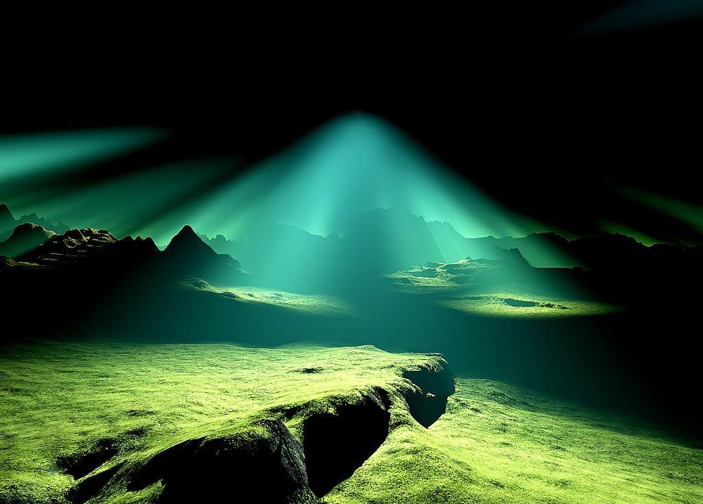 Green light beams over alien landscape