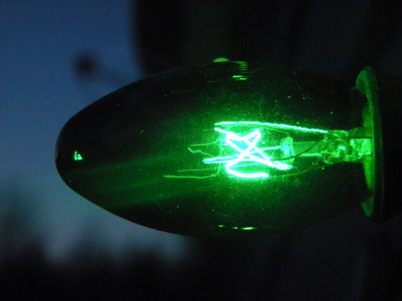 green light bulb glowing