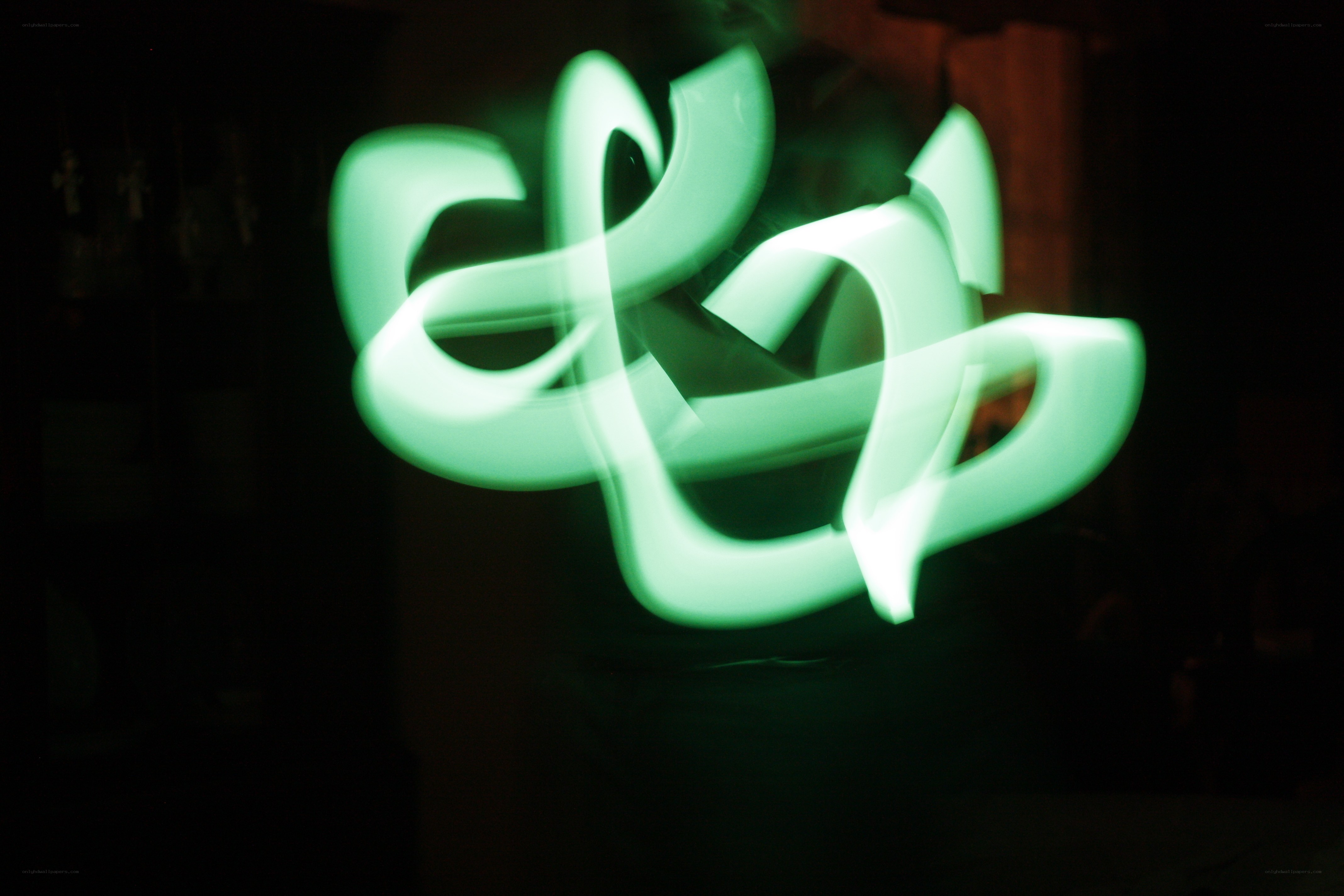 Green light graffiti in dark room