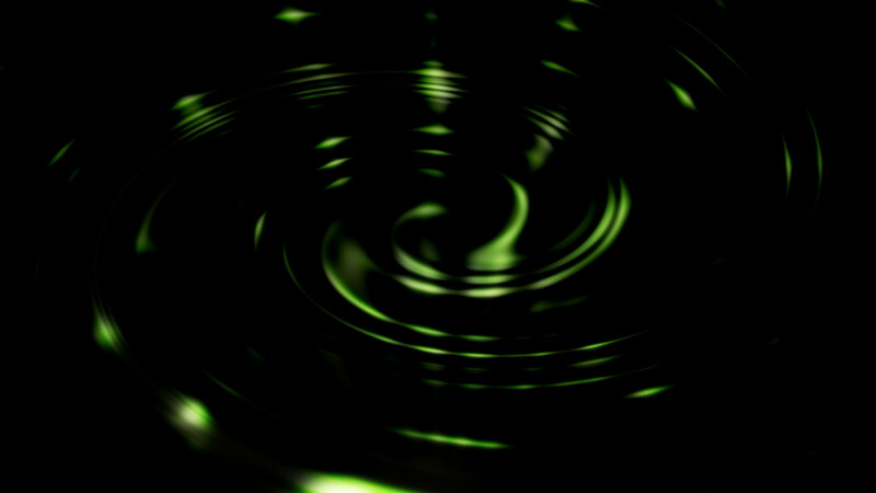green light ripples on black