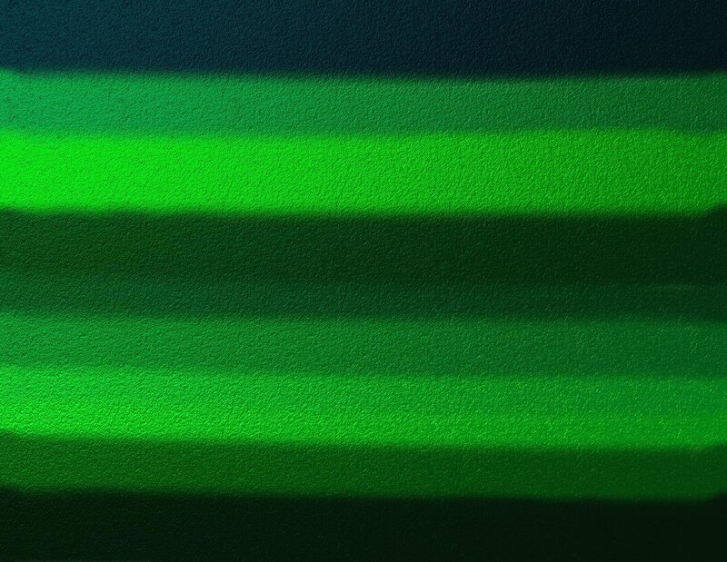 green light stripes on textured surface