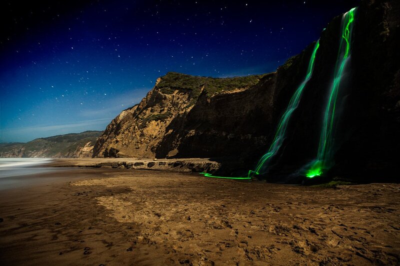 Green light waterfall at night