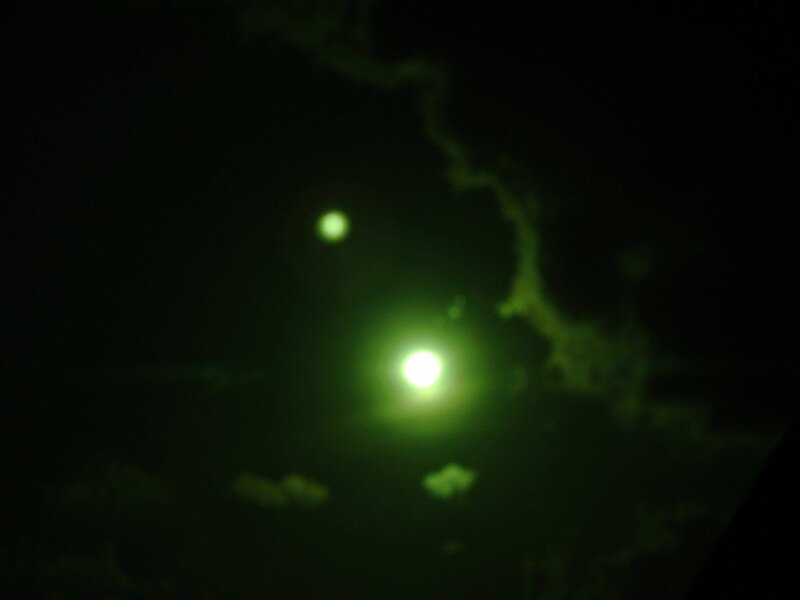 Green Lights in Night Sky