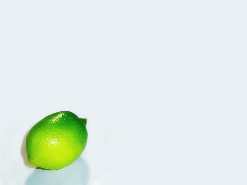 green lime on white surface