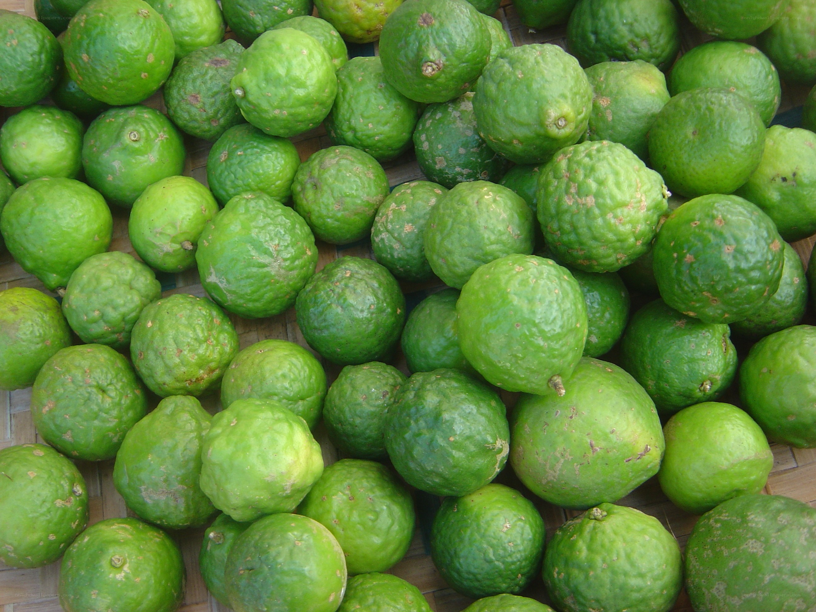 green limes on a basket