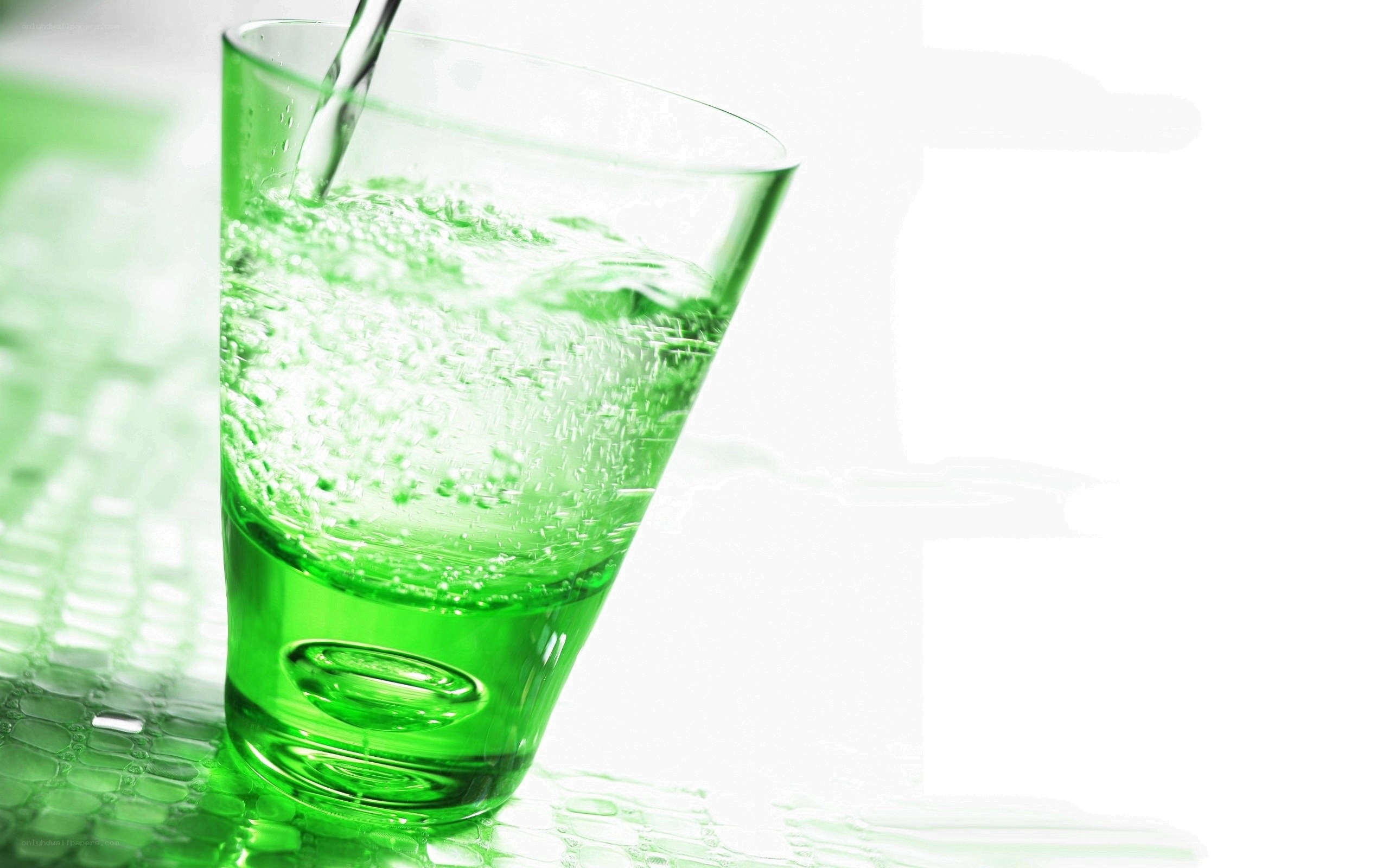 green liquid being poured