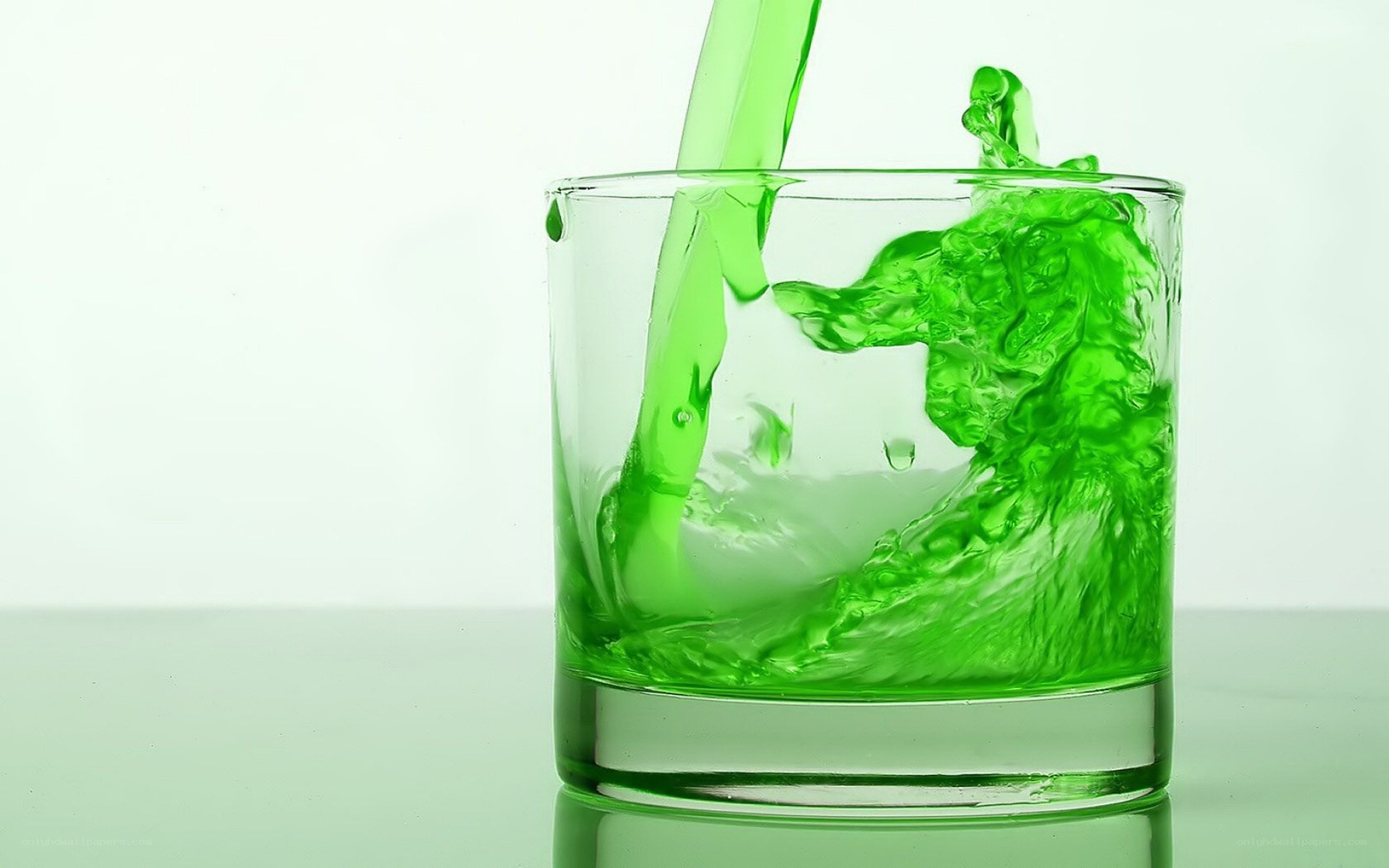 green liquid being poured