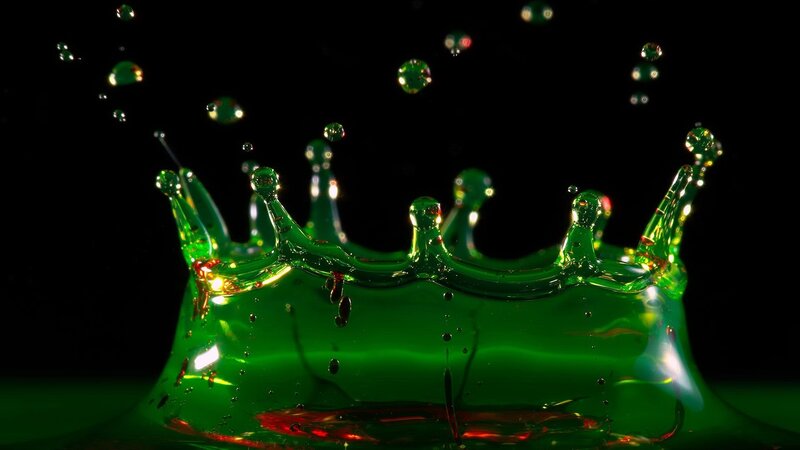 green liquid crown splash