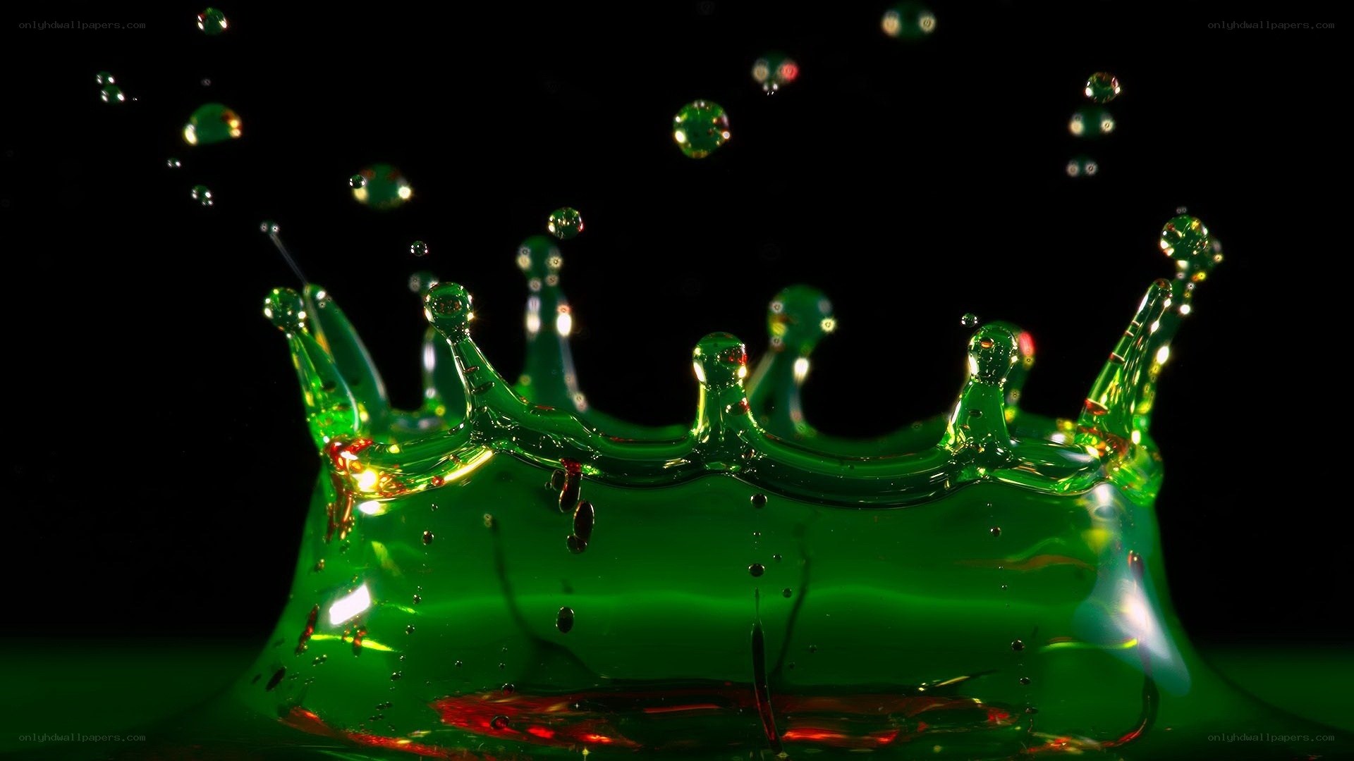 green liquid crown splash