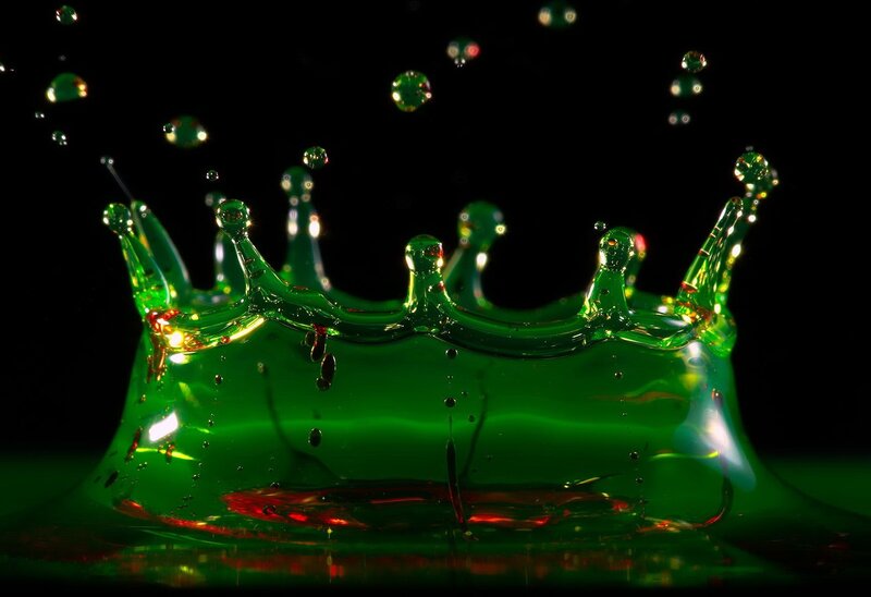 green liquid crown splash