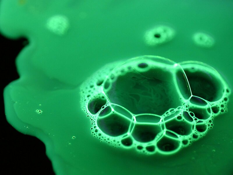 green liquid foam bubbles