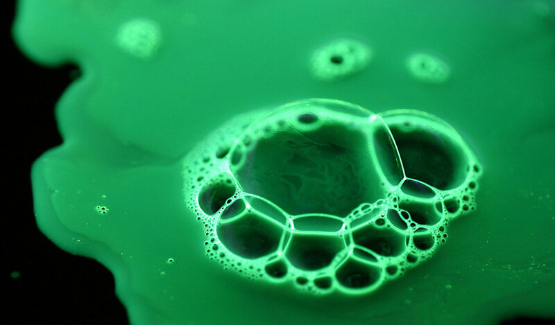 green liquid foam bubbles