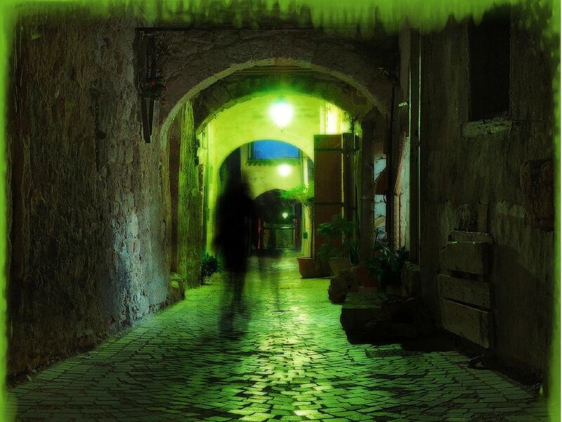 green-lit alley at night