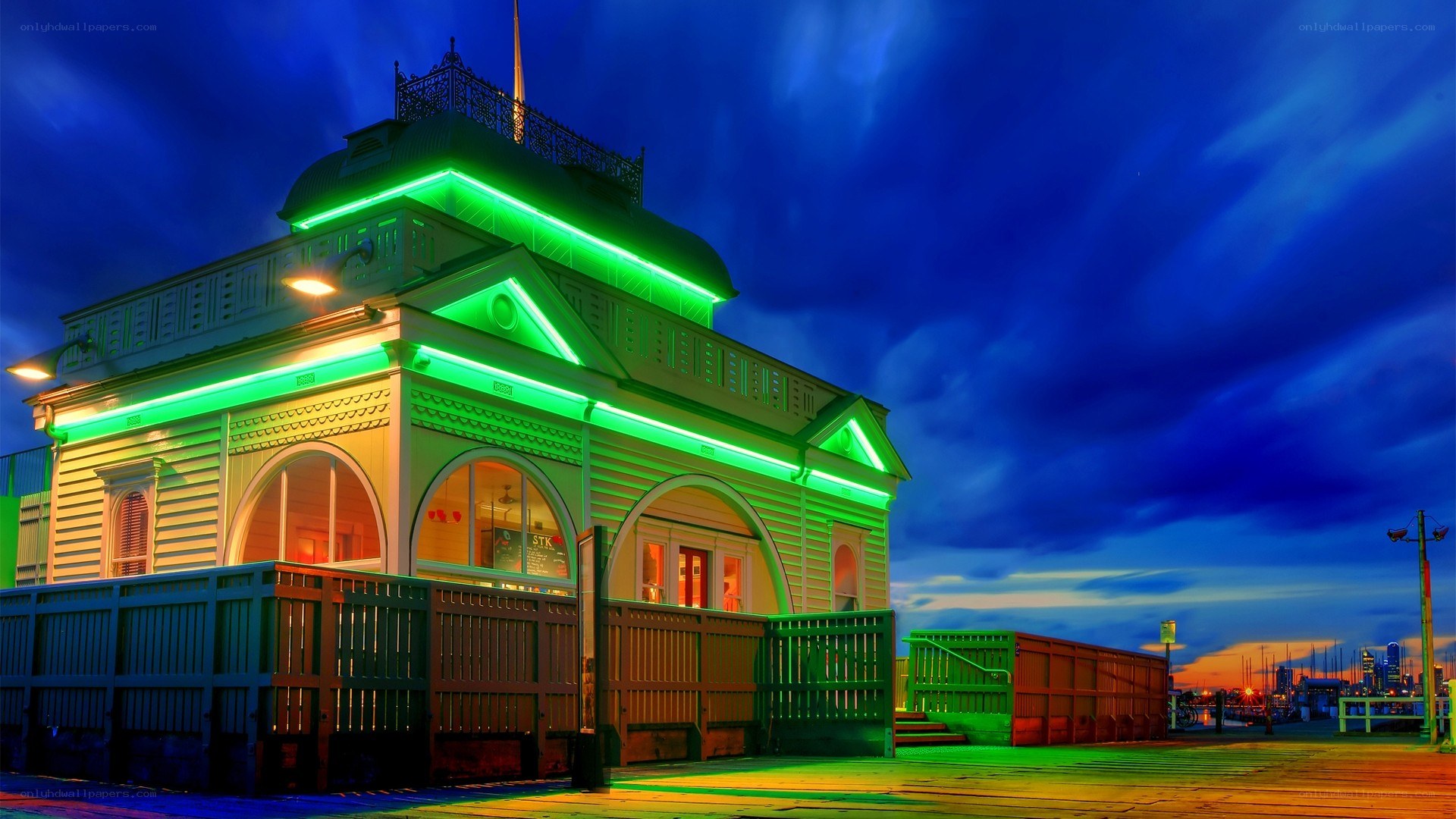 green-lit building at dusk