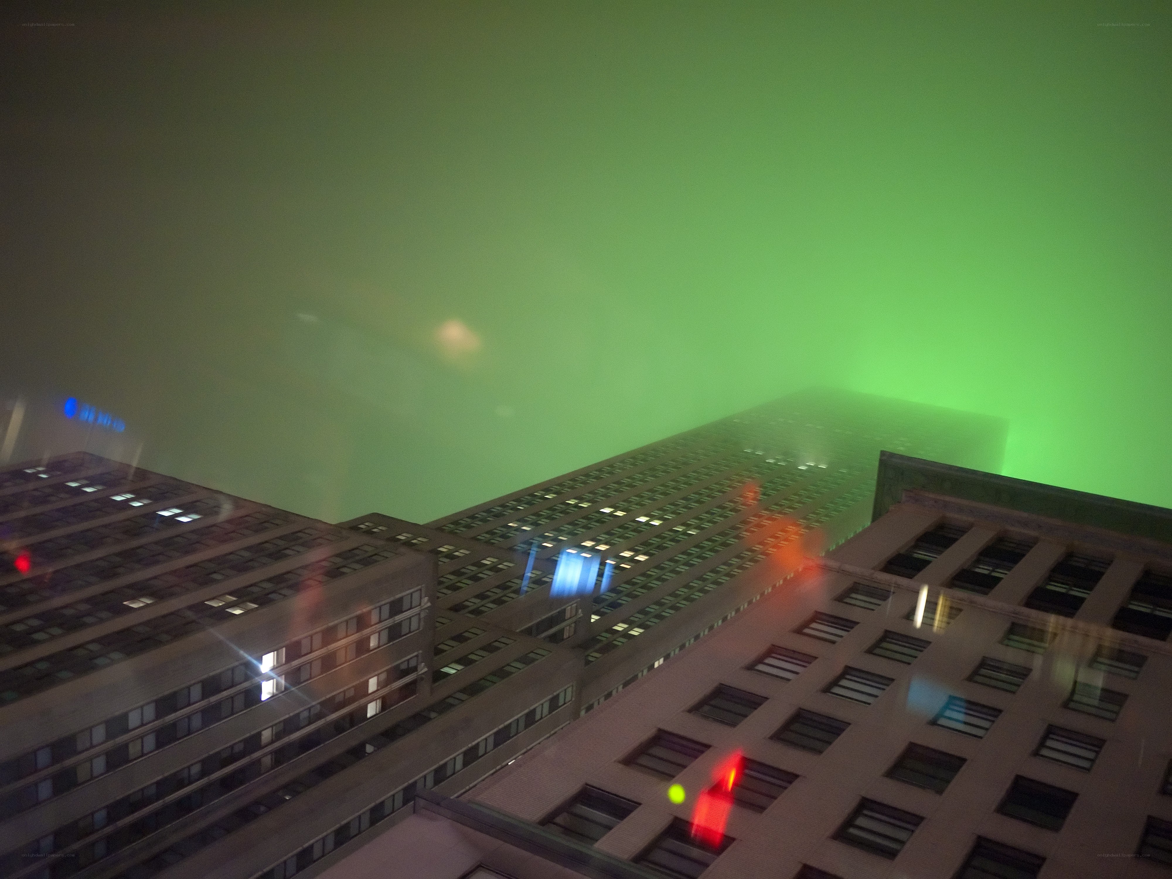 green-lit city skyline at night