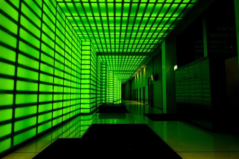 green-lit corridor hallway