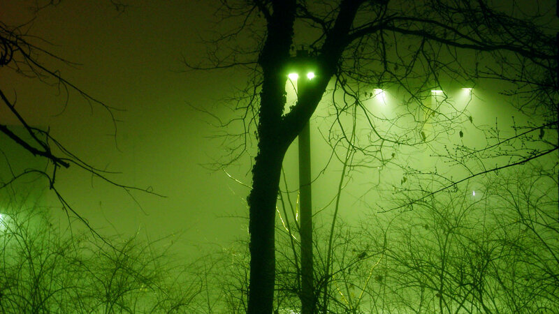 green-lit foggy night scene