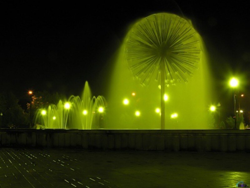 green-lit fountain at night