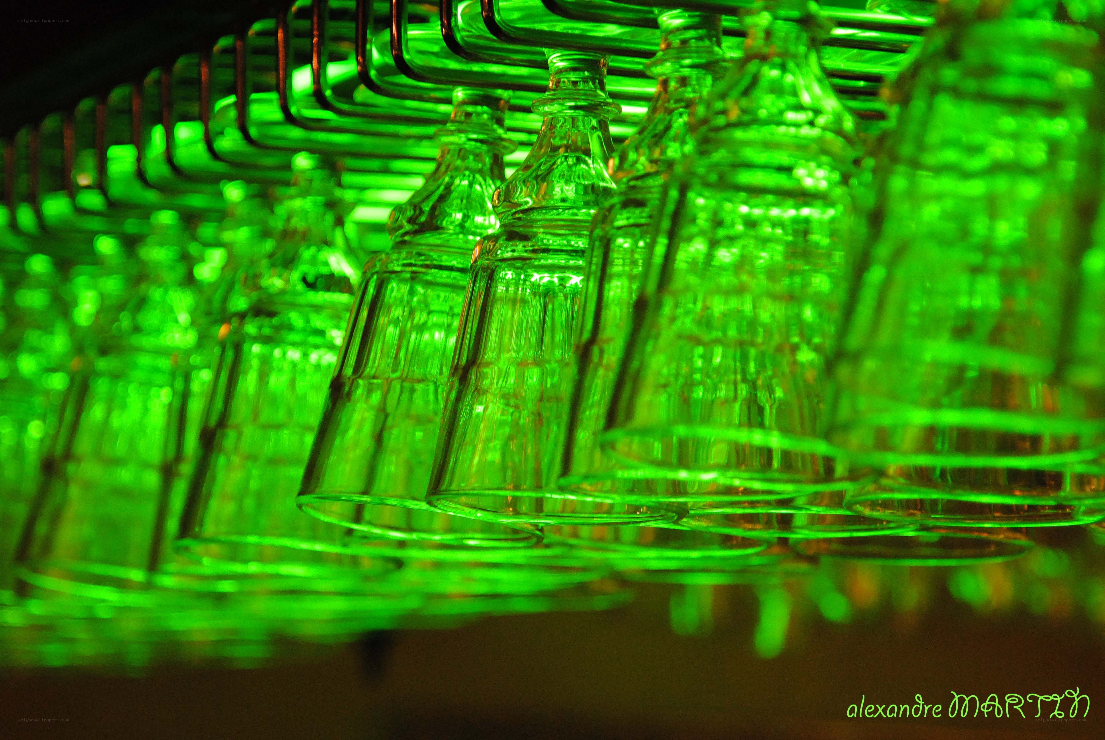 Green-lit glasses hanging
