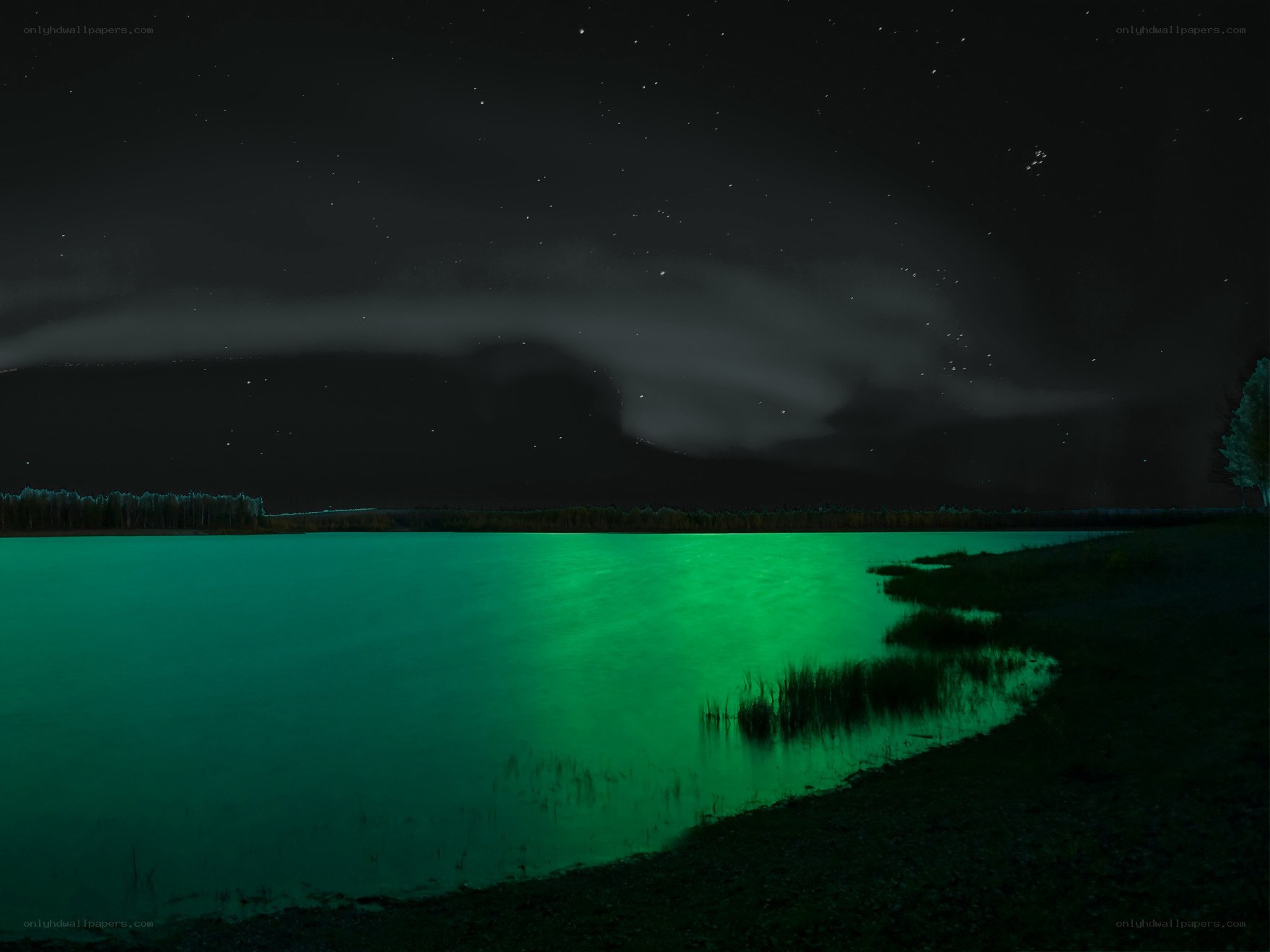 Green-lit lake under starry sky