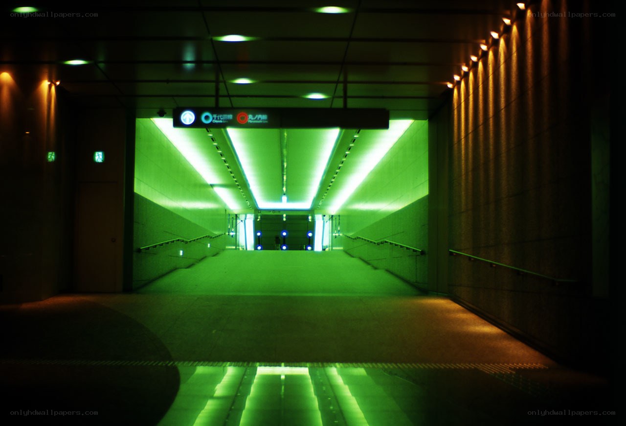 green-lit subway tunnel
