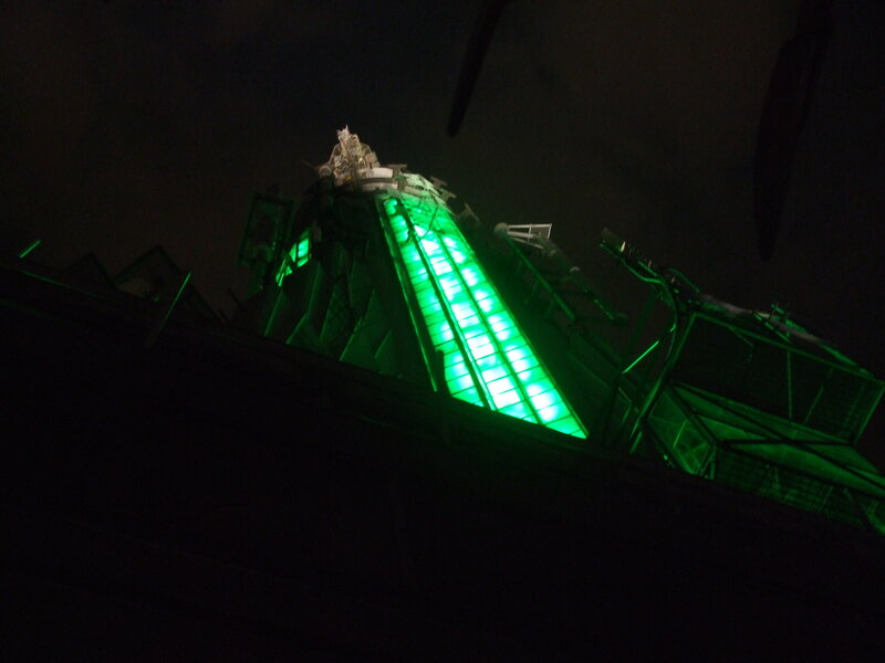 green-lit tower at night