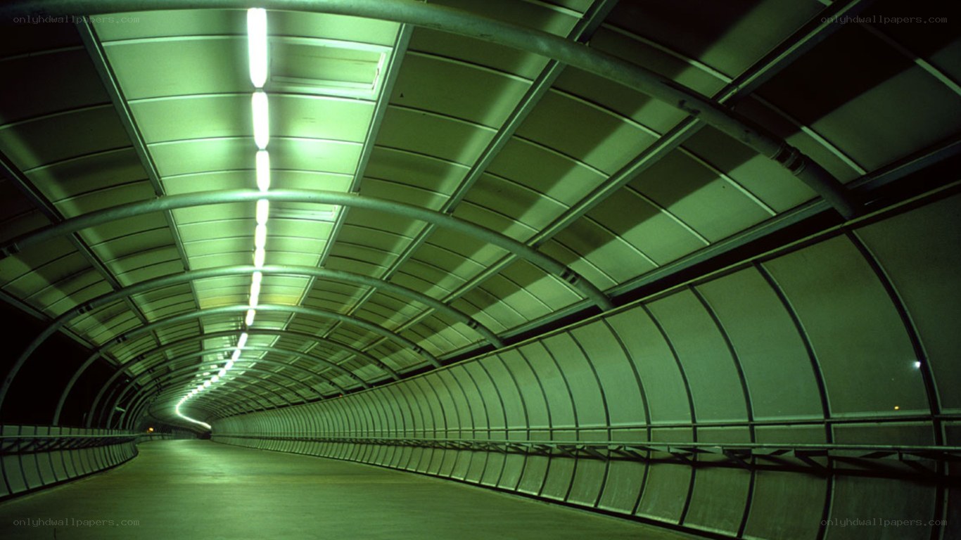 Green-lit tunnel corridor
