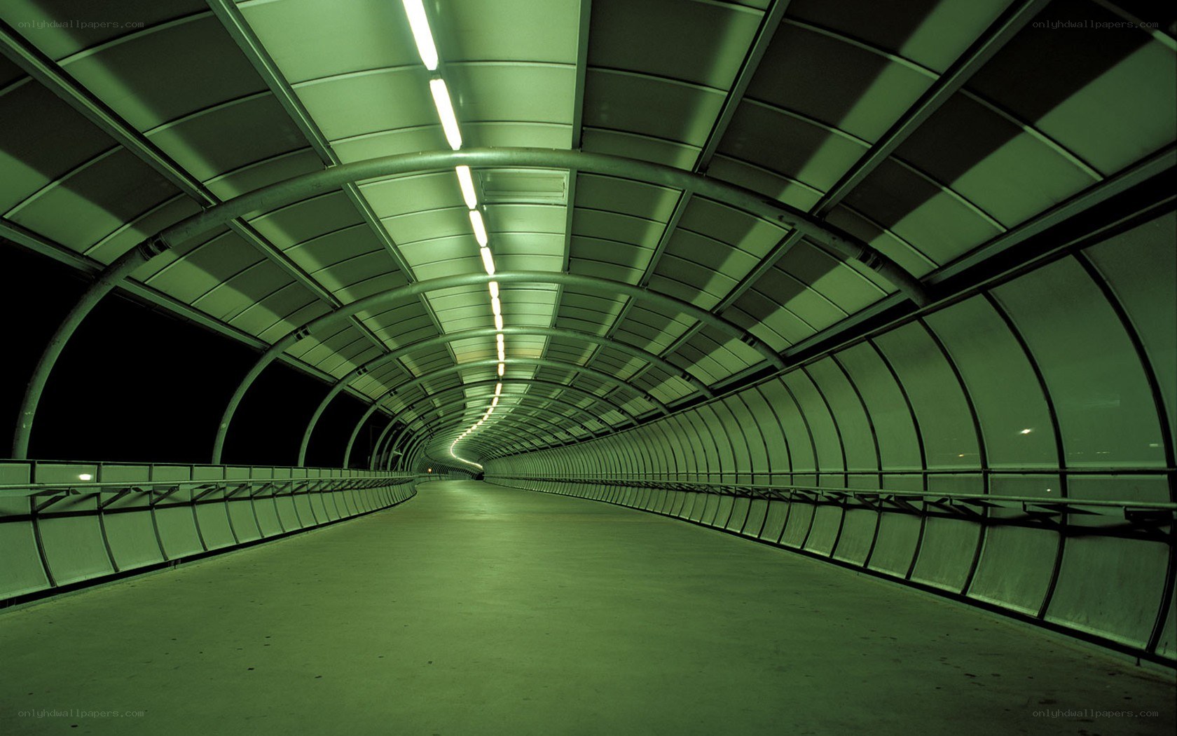 green-lit tunnel corridor