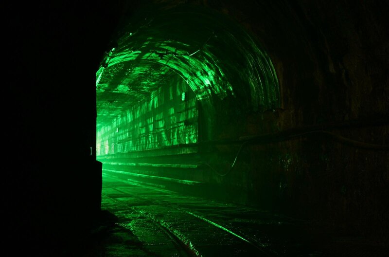 green-lit tunnel interior