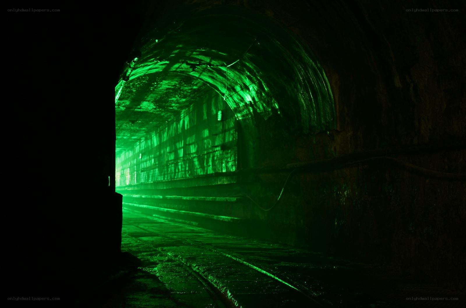 green-lit tunnel interior