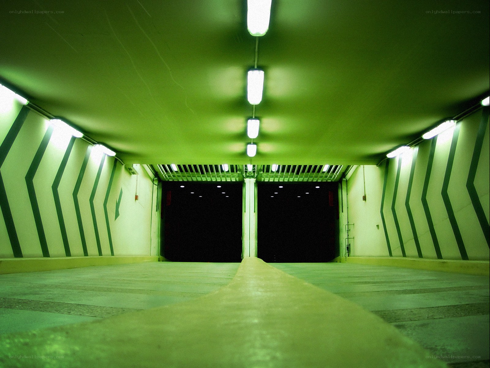 green-lit tunnel with arrows