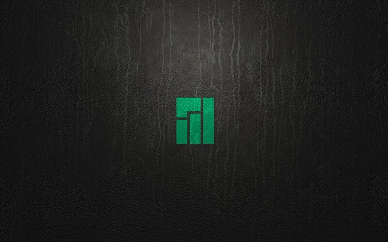 Green Logo on Black Surface