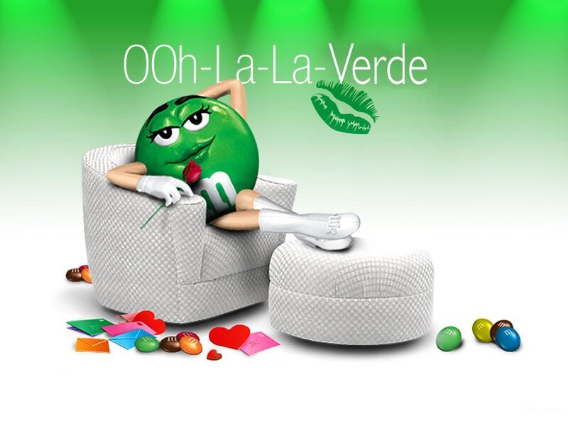 Green M&M character lounging