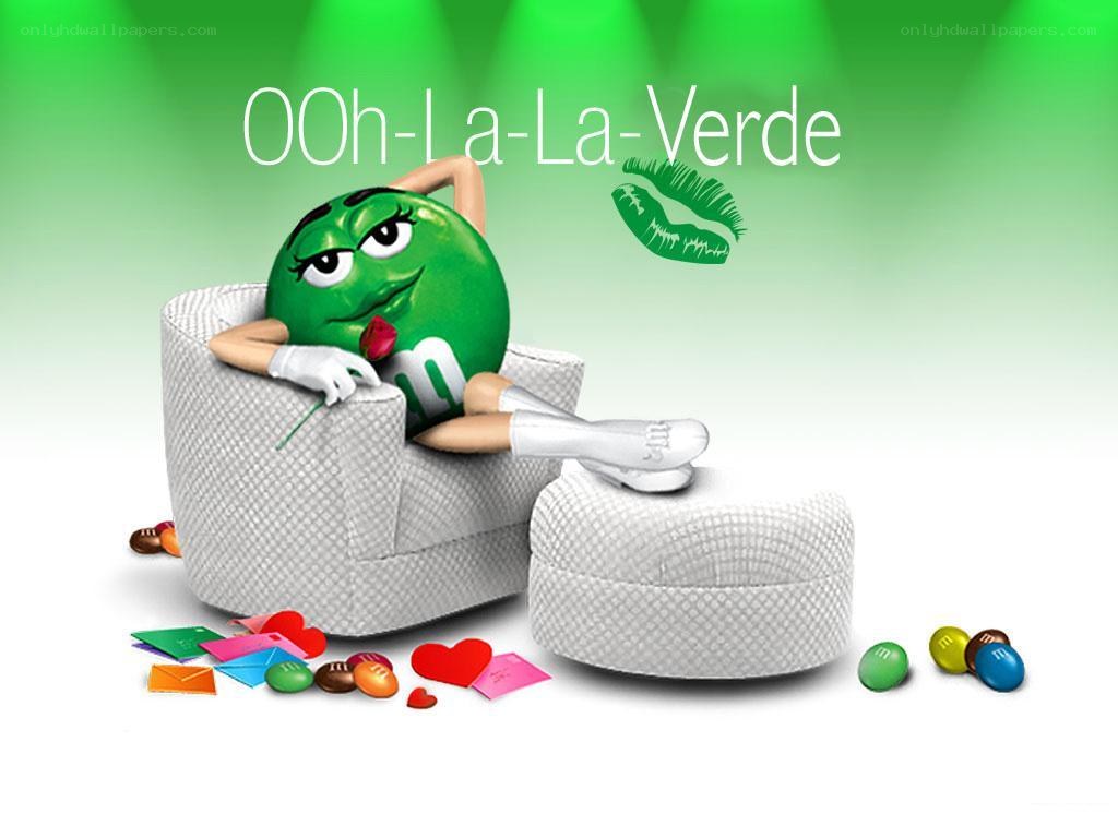 Green M&M character lounging
